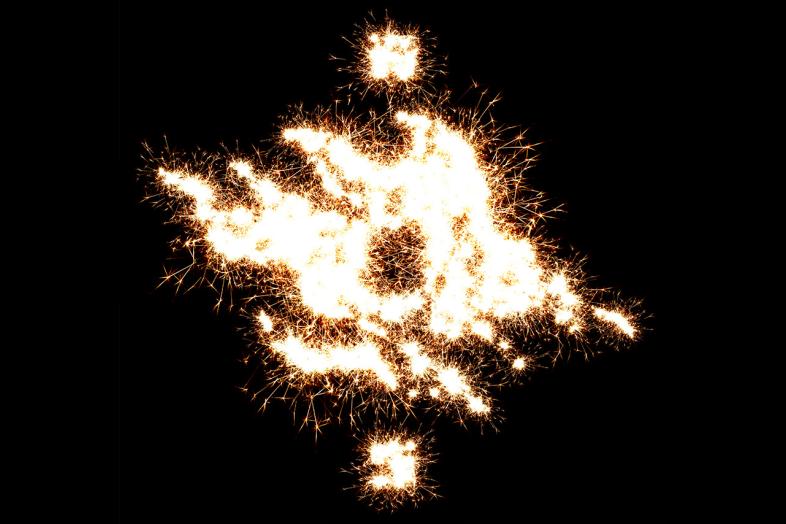 Helsingin yliopiston liekkilogo ja tähtisadetta.