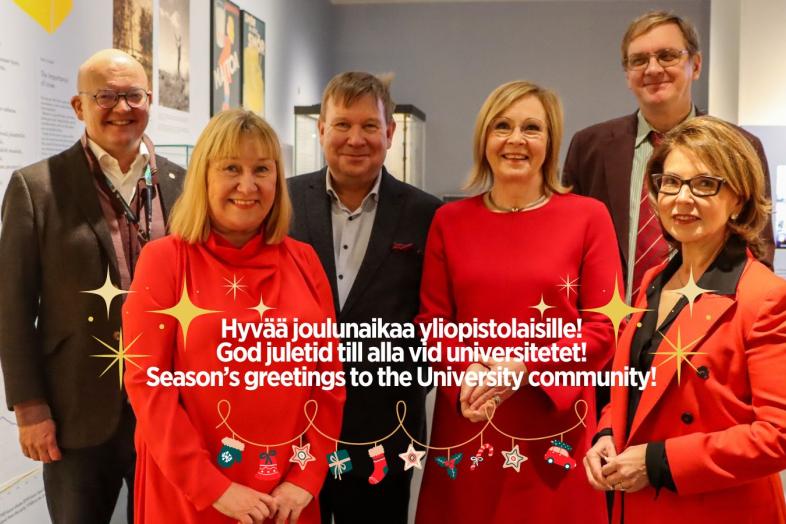 Taustalla yliopiston rehtoraatti, etualalla teksti "Hyvää joulua yliopistolaisille".