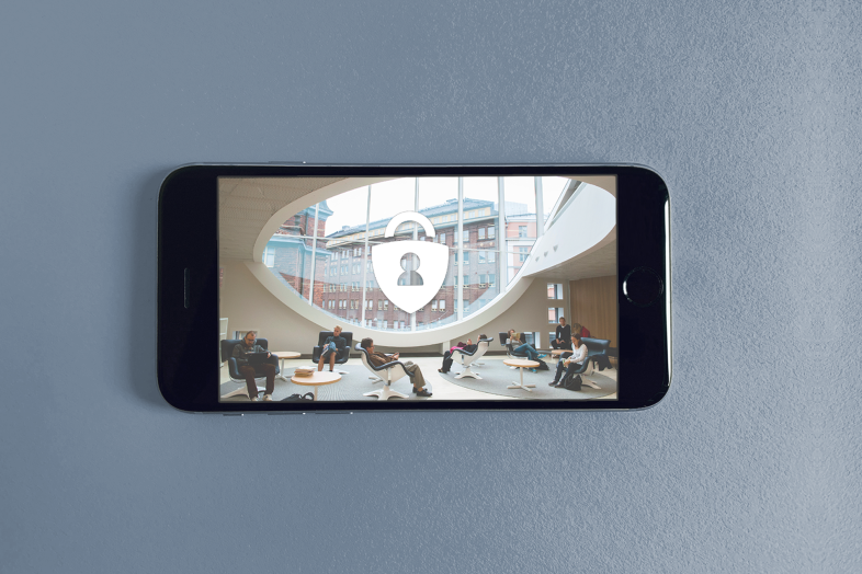 kännykkä, ruudulla kuva yliopiston tiloista ja lukkokuvake