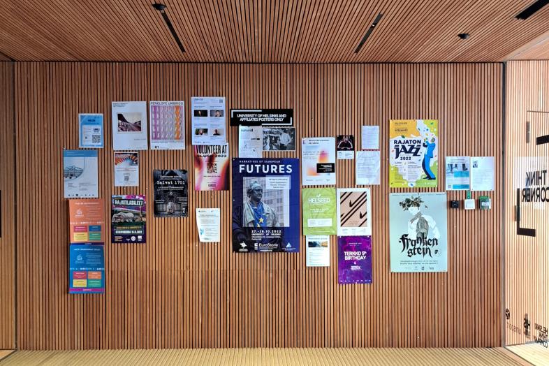 Posters on the wall of the Think Corner lobby.